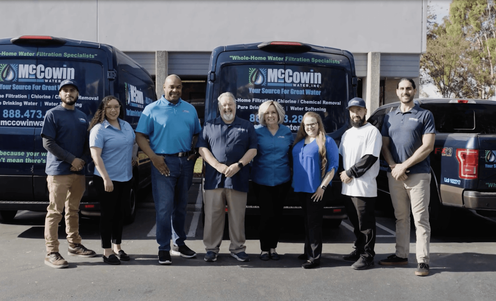 McCowin Water team posing in front of company headquarters, showcasing our expert staff responsible for reverse osmosis and home water filtration system innovations.